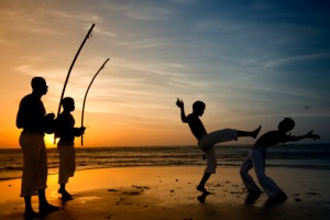 Capoeira and berimbau player